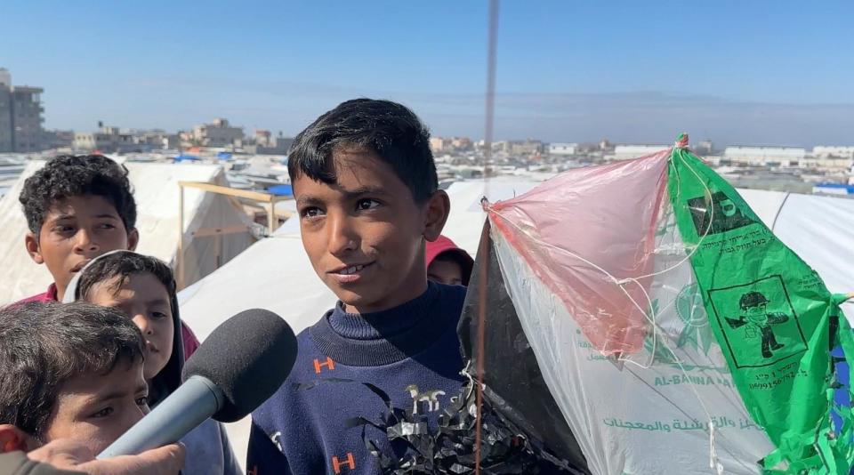 PHOTO: Children in Gaza fly kites on Friday, Feb. 9 as military escalation looms. For these children, they said flying kites is a welcome distraction from the grim reality of life in Rafah's tent city. (ABC News)