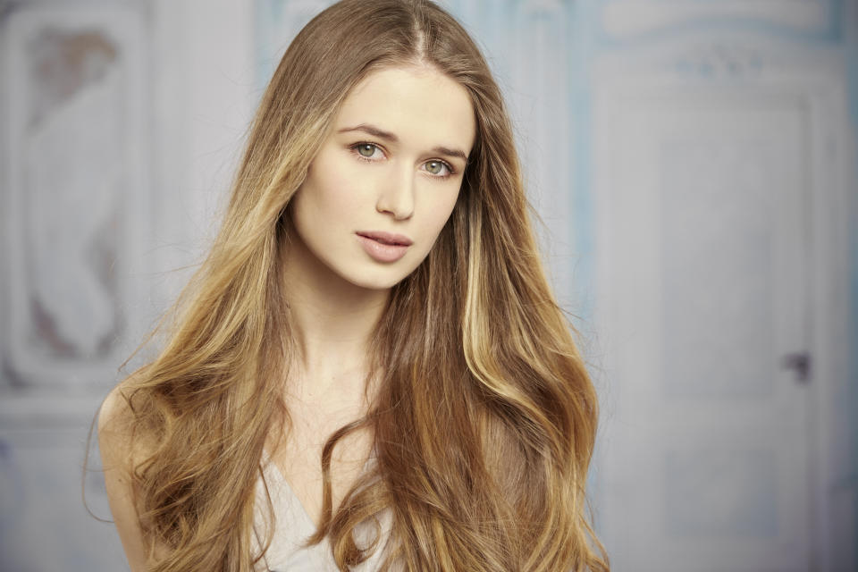 blonde woman with beutiful long hair and natural look posing for a portrait