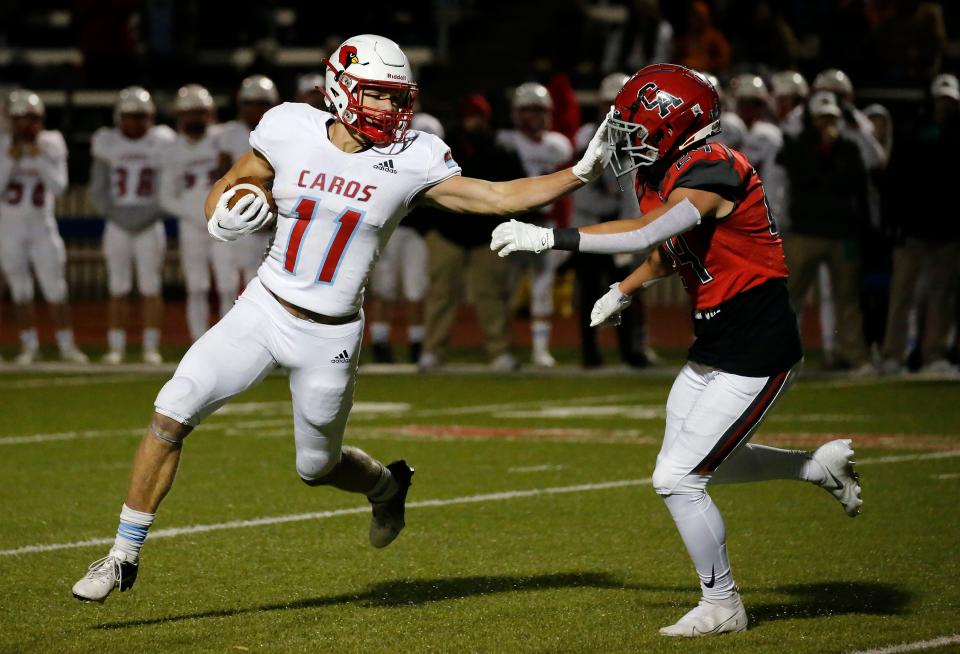 Collinsville's Oscar Hammond (11) goes against Carl Albert's Chancey Lester (24) during a Class 5A football semifinal Friday night at Western Heights.