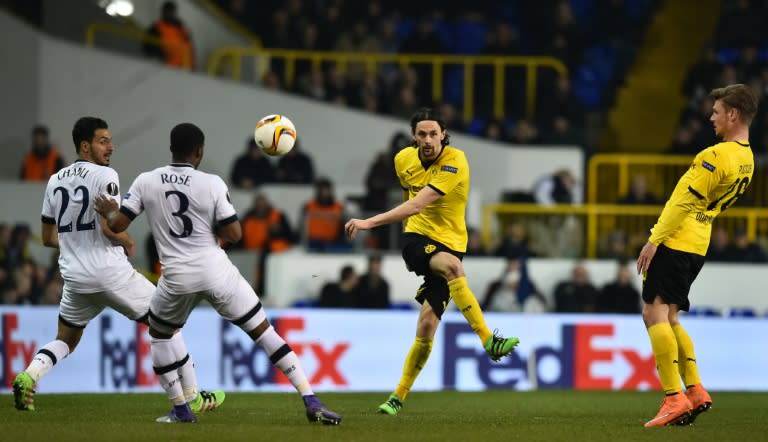 Borussia Dortmund's Neven Subotic (2nd R) makes an unsuccessful shot during the match against Tottenham Hotspur at White Hart Lane in London on March 17, 2016