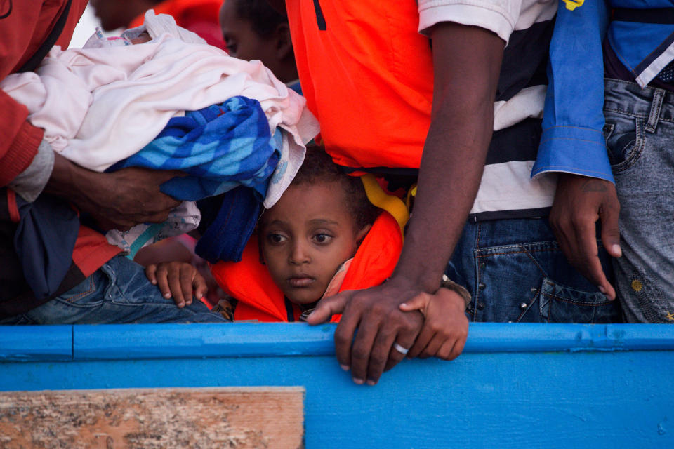 <p>A boy looks on inside a crowded wooden boat carrying more than seven hundred migrants before being rescued, during a rescue operation in the Mediterranean sea, about 13 miles north of Sabratha, Libya, Monday, Aug. 29, 2016. (AP Photo/Emilio Morenatti) </p>