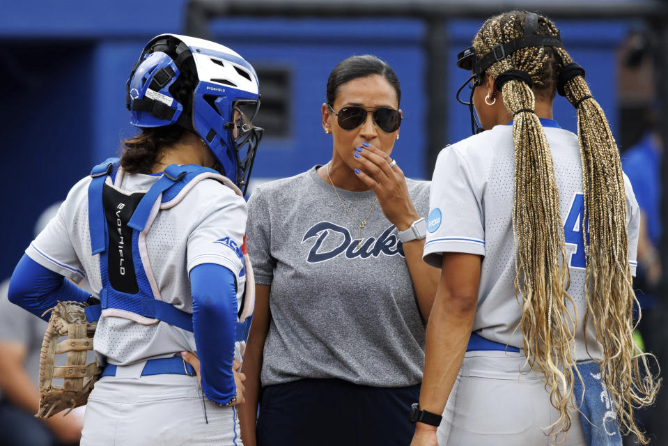 Duke head coach Marissa Young, center, speaks with Jala Wright, right, and Kelly Torres, left, during an NCAA college softball game against Morgan State, Friday, May 17, 2024, in Durham, N.C. (AP Photo/Ben McKeown)