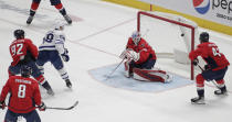 Toronto Maple Leafs' Michael Bunting (58) scores a goal against Washington Capitals goalie Ilya Samsonov during the first period of an NHL hockey game Monday, Feb. 28, 2022, in Washington. (AP Photo/Luis M. Alvarez)