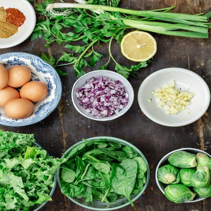 Ingredients for green shakshuka in bowls.