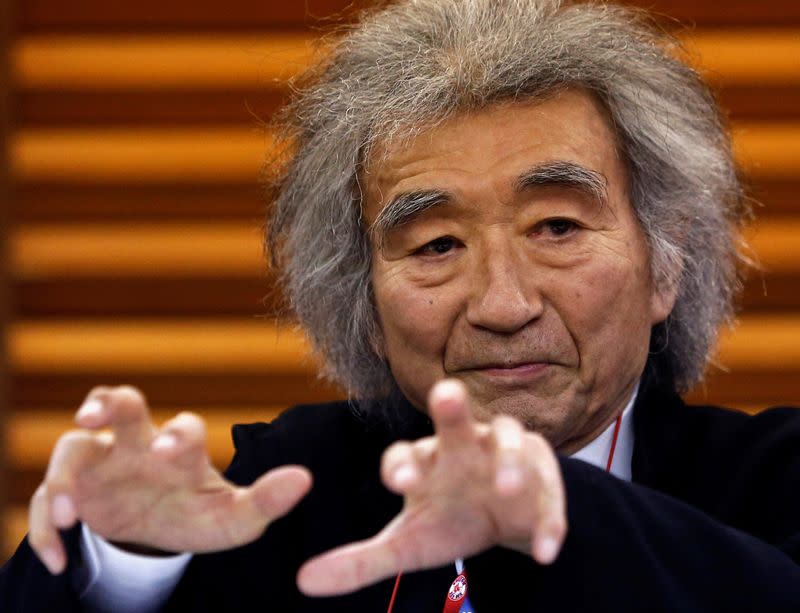 FILE PHOTO: Japan's maestro Ozawa gestures during a news conference in Tokyo