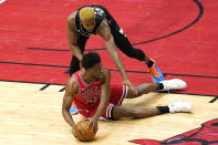 Chicago Bulls forward Thaddeus Young, bottom, looks to pass as Milwaukee Bucks forward Mamadi Diakite guards during the first half of an NBA basketball game in Chicago, Sunday, May 16, 2021. (AP Photo/Nam Y. Huh)