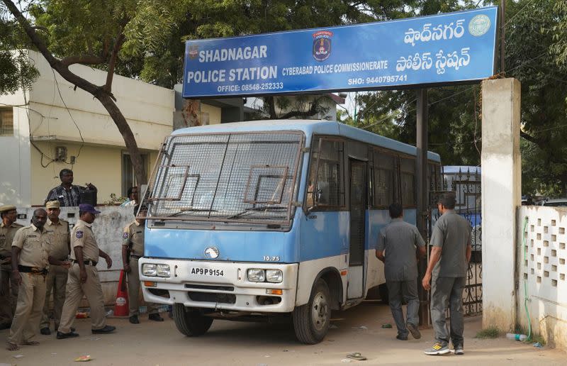 A police van carrying four men accused of the alleged rape and murder of a 27-year-old woman, leaves a police station in Shadnagar