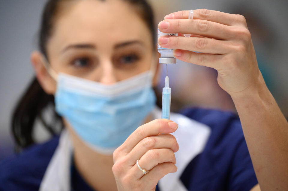 File photo dated 16/12/21 of medical staff preparing shots of the Moderna Covid-19 vaccine, as American pharmaceutical giant Moderna will open a new research and manufacturing centre in the UK.