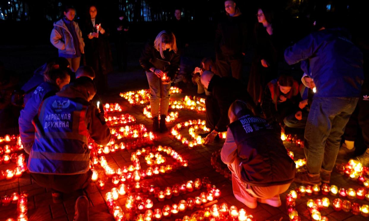 <span>People pay tribute to the victims of Friday’s terrorist attack in Moscow.</span><span>Photograph: Alexander Ermochenko/Reuters</span>