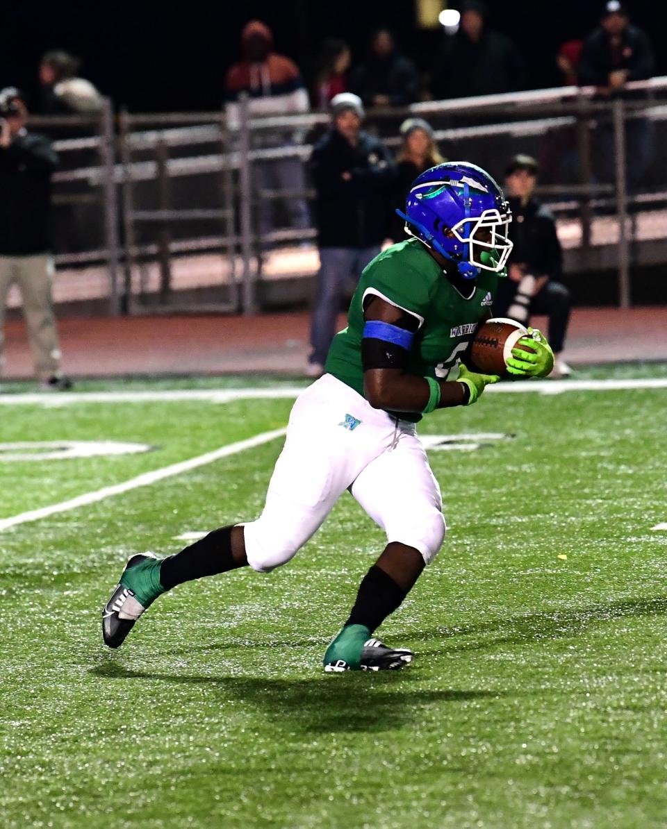 Trey Cornist sees a first down coming for Winton Woods at the OHSAA Division II region semifinal football game, Nov. 11.