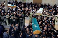 Man grieves during a funeral for earthquake victims in Elazig