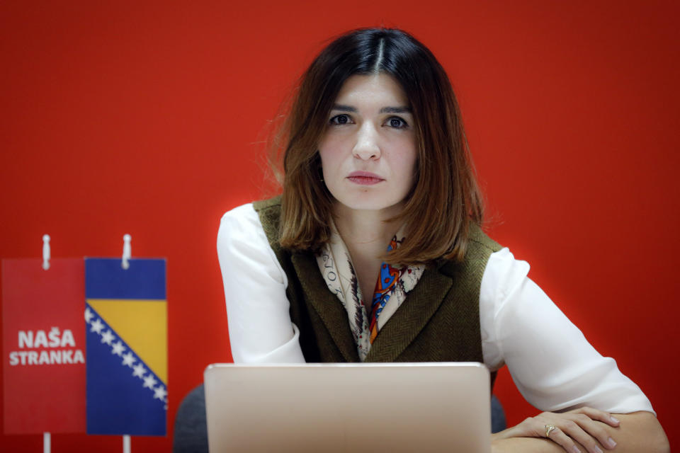 Bosnian lawmaker Sabina Cudic poses for the media, in Sarajevo, Bosnia, Thursday, Nov. 21, 2019. Protesters in Bosnia have rallied outside the government building in Sarajevo after opposition lawmaker Sabina Cudic published shocking photos of special needs children tied to beds and radiators in a nearby government facility. The protest Thursday by 1,000 people included scores of parents of children with disabilities, who described a dysfunctional care system that condemns their kids to suffering and excludes them from society. (AP Photo/Almir Alic)