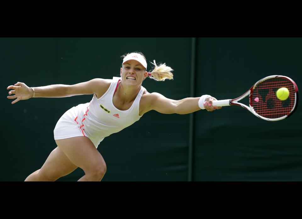 Ekaterina Makarova of Russia returns a shot against Angelique Kerber of Germany during a second round women's singles match at the All England Lawn Tennis Championships at Wimbledon, England, Thursday, June 28, 2012.