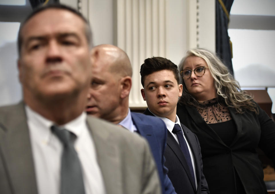 Kyle Rittenhouse, third from left, stands with his legal team, from left, Mark Richards, Corey Chirafisi and Natalie Wisco as the jury leaves the room for the day at the Kenosha County Courthouse in Kenosha, Wis., on Friday, Nov. 5, 2021. (Sean Krajacic/The Kenosha News via AP, Pool)