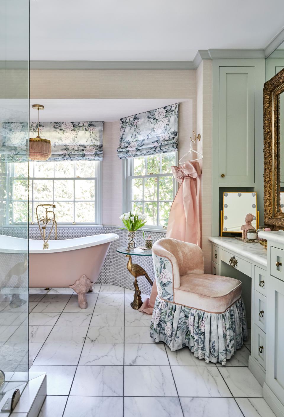 Roxy’s pink bathroom is one of her favorite places in the house. “I spend a lot of time at my little vanity, even just on the phone,” she says. “I love my floral old-lady vanity chair, it’s so cute.” She looked to Osborne & Little for the drapery and chair fabric.
