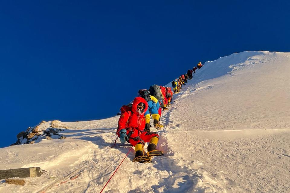 This photograph taken on 12 May shows mountaineers as they climb during their ascent to Mount Everest’s 8,849m high summit (AFP/Getty)