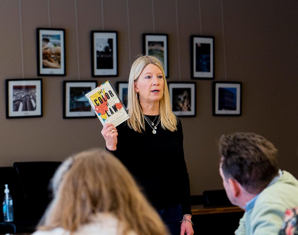 Anne O’Connor, co-founder of Bay Bridge, a Whitefish Bay based organization missioned to raise awareness about racial and cultural bias, speaks on useful books to learn more about racially restrictive covenants during their members meeting on Sunday February 19, 2023 at Whitefish Bay Public Library in Whitefish Bay, Wis. Jovanny Hernandez / Milwaukee Journal Sentinel