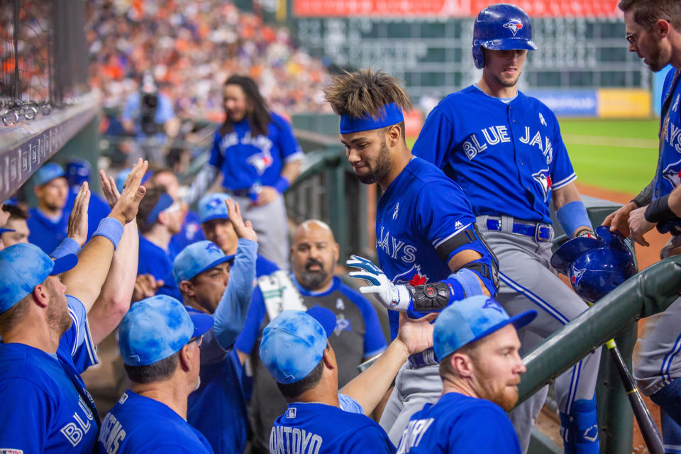 HOUSTON, TX - JUNE 16: Toronto Blue Jays left fielder Lourdes Gurriel Jr. (13) celebrates with teammates after hitting a two-run homer in the fifth inning of a MLB baseball game between the Houston Astros and the Toronto Blue Jays on June 16, 2019, at Minute Maid Park in Houston, TX. (Photo by Juan DeLeon/Icon Sportswire via Getty Images)