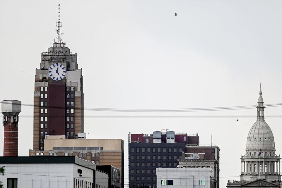 A giant lug nut graces the skyline near the intersection of East Michigan Avenue and South Cedar Street downtown.