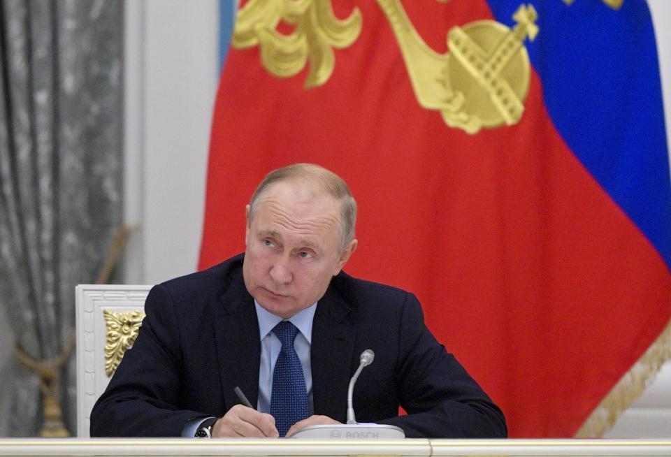 Russian President Vladimir Putin chairs a meeting with officials in the Kremlin in Moscow, Russia, Tuesday, Nov. 5, 2019. The meeting focused on language issues. (Alexei Druzhinin, Sputnik, Kremlin Pool Photo via AP)