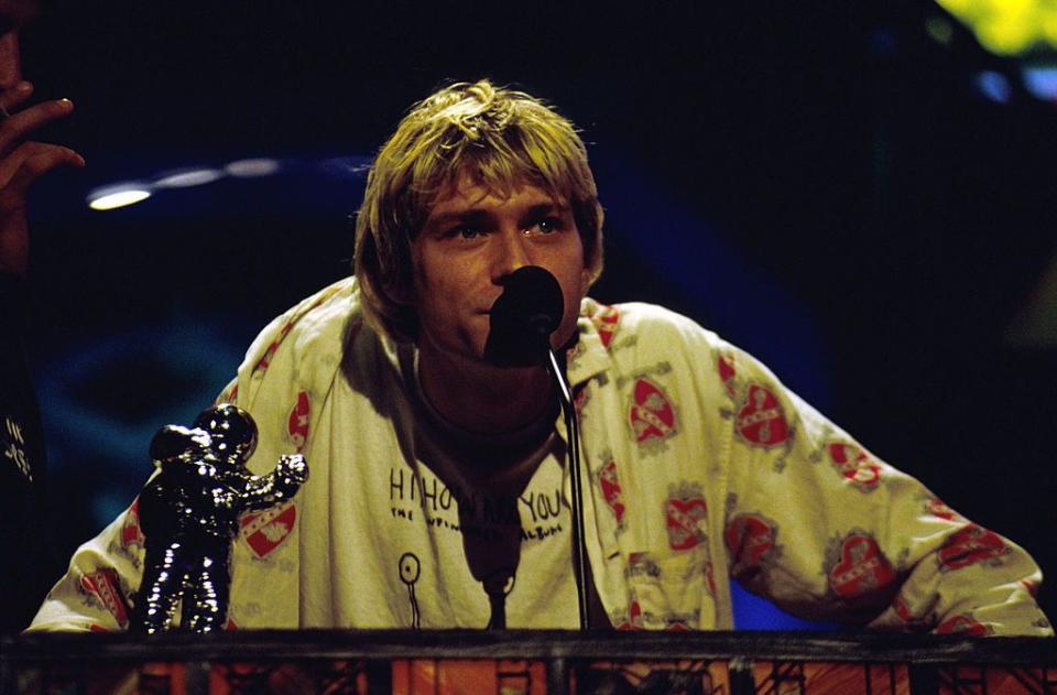 <p>Kurt Cobain accepting an award at the 1992 MTV VMAs. Nirvana has seven VMA awards in total.</p>