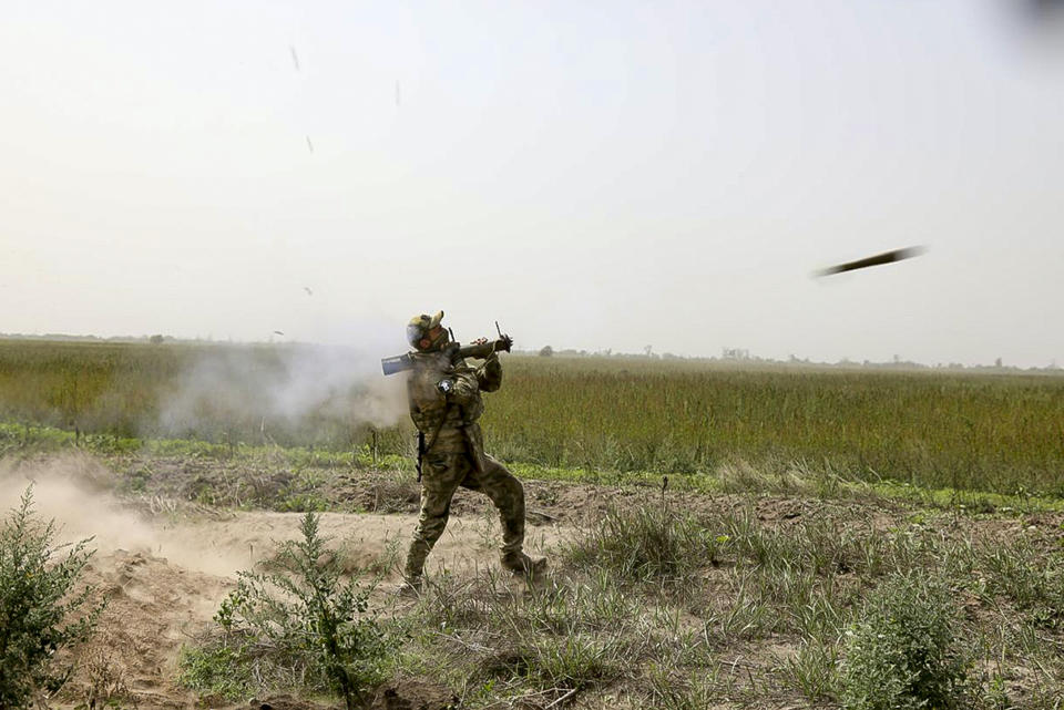 In this handout photo taken from video released by Russian Defense Ministry Press Service on Sunday, Sept. 11, 2022, A Russian paratrooper fires a Russian man-portable missile on a mission on the Nikolaev-Krivoy Rog direction in Ukraine. (Russian Defense Ministry Press Service via AP)