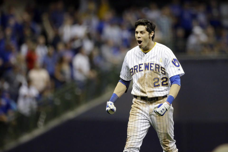 Milwaukee Brewers' Christian Yelich celebrates after driving in the winning run with a double during the ninth inning of the team's baseball game against the Chicago Cubs on Saturday, Sept. 7, 2019, in Milwaukee. The Brewers won 3-2. (AP Photo/Aaron Gash)