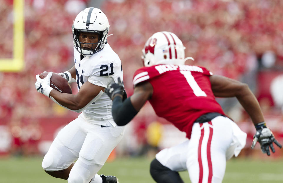 Sept. 4, 2021; Madison, Wisconsin; Penn State Nittany Lions running back Noah Cain (21) rushes with the football as Wisconsin Badgers cornerback Faion Hicks (1) defends during the third quarter at Camp Randall Stadium. Jeff Hanisch-USA TODAY Sports