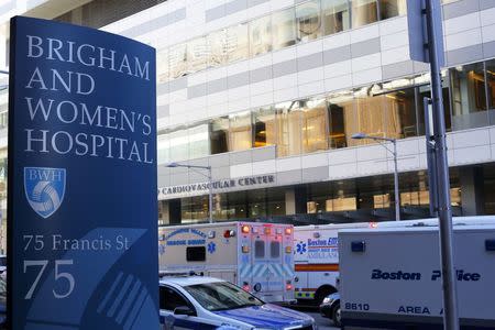 Police and ambulance vehicles surround the building where a shooting occurred at Brigham and Women's hospital in Boston, Massachusetts January 20, 2015. REUTERS/Brian Snyder
