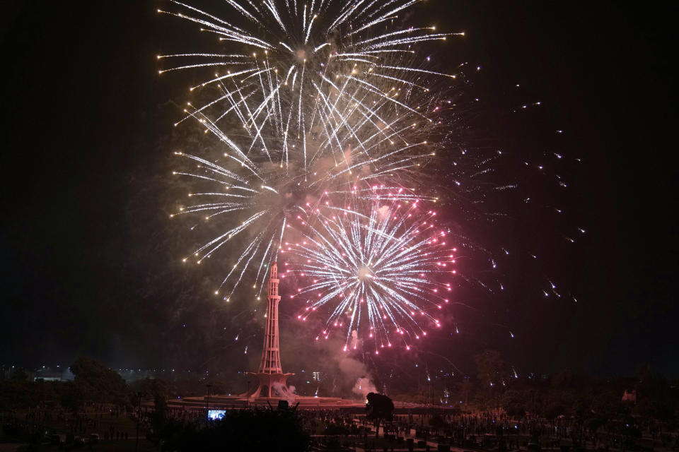 Fireworks light the sky close to the Minar-e-Pakistan or Pakistan monument during the Pakistan Independence Day celebrations, in Lahore, Pakistan, Monday, Aug. 14, 2023. (AP Photo/K.M. Chaudary)