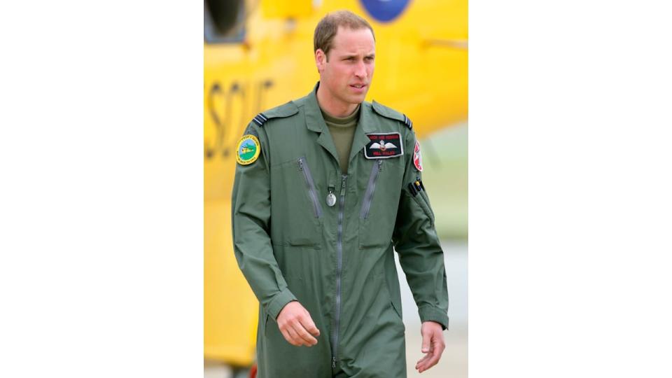 Prince William disembarks his RAF Search and Rescue Sea King Helicopter after giving his father Prince Charles, Prince of Wales a tour at RAF Valley on July 9, 2012 