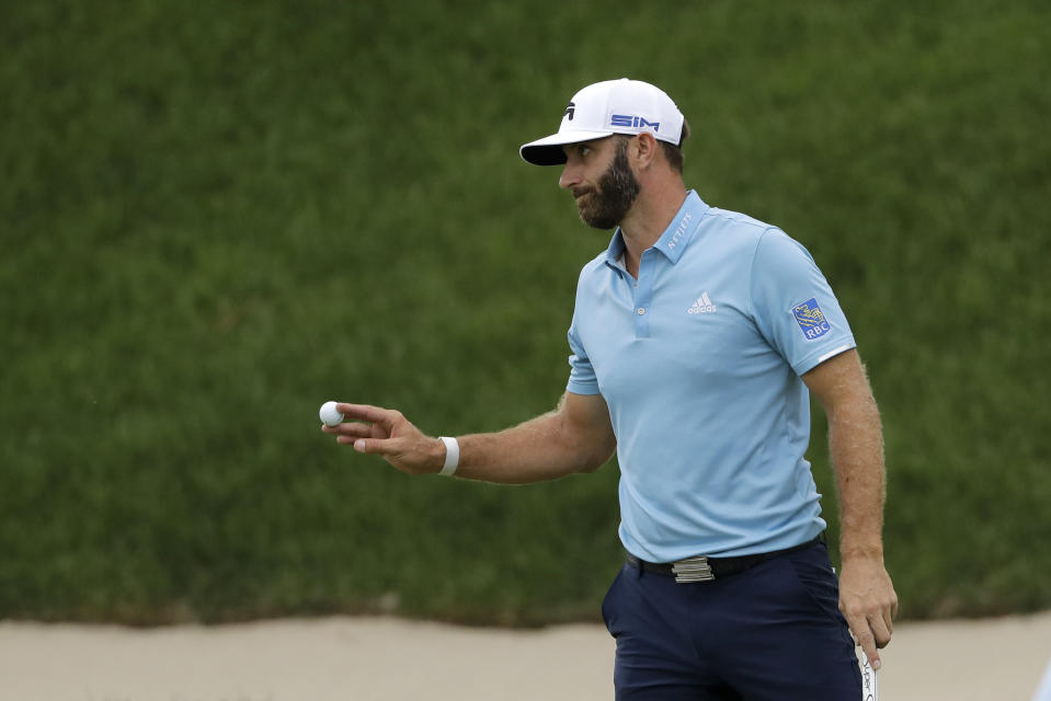Dustin Johnson reacts after sinking his putt on the 18th green to win the final round of the Travelers Championship golf tournament at TPC River Highlands, Sunday, June 28, 2020, in Cromwell, Conn. (AP Photo/Frank Franklin II)