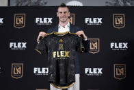 Gareth Bale poses for photos after being introduced as a new member of the Los Angeles FC MLS soccer club Monday, July 11, 2022, in Los Angeles. (AP Photo/Marcio Jose Sanchez)