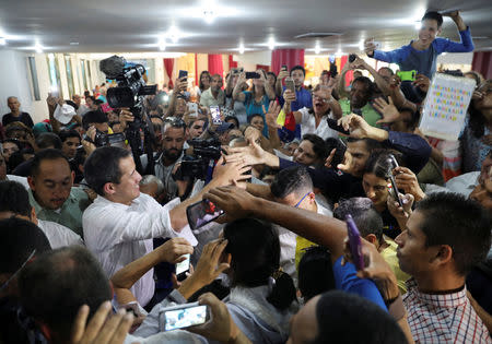 Venezuelan opposition leader Juan Guaido, who many nations have recognised as the country's rightful interim ruler, greets supporters in Maracay, Venezuela, April 26, 2019. REUTERS/Manaure Quintero