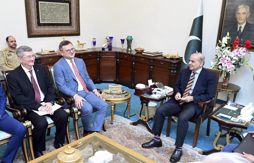 CORRECTS DAY TO THURSDAY, In this photo released by Pakistan Prime Minister Office, Prime Minister Shahbaz Sharif, right, meets with Ukraine's Foreign Minister Dmytro Kuleba, second left, at the Prime Minister's House, in Islamabad, Pakistan, Thursday, July 20, 2023. (Pakistan Prime Minister Office via AP)