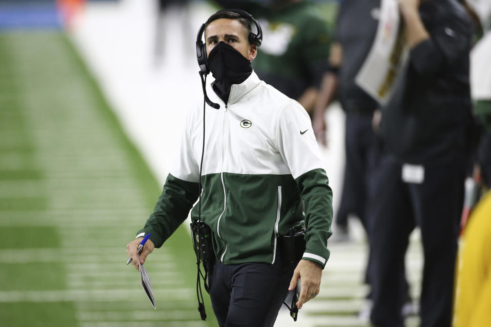 FILE - In this Dec. 13, 2020, file photo, Green Bay Packers coach Matt LaFleur looks to the scoreboard during the first half of the team's NFL football game against the Detroit Lions in Detroit. LaFleur was the Los Angeles Rams’ offensive coordinator in 2017 during the first year of Sean McVay’s head coaching tenure after they spent four seasons working together on Mike Shanahan’s Washington staff. The Packers and the Rams meet in in a playoff game this weekend. (AP Photo/Leon Halip, File)
