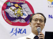 Yuichi Tsuda, Hayabusa2 project manager at Japan Aerospace Exploration Agency, speaks during a press conference at JAXA's Sagamihara Campus in Sagamihara, near Tokyo Sunday, Dec. 6, 2020. Japanese space officials said Sunday they are excited about bringing home a capsule carrying soil samples from a distant asteroid and safely landed on Australian Outback and look inside and analyzing what's inside. (Masanori Takei/Kyodo News via AP)