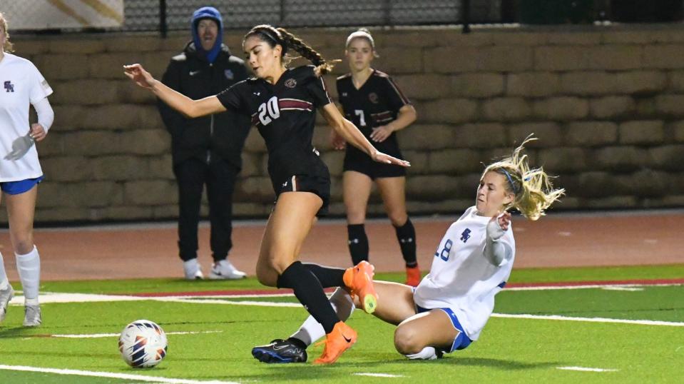 Oaks Christian's Jonnie-Jane Quiroz is tripped from behind by a Santa Margarita player during the first match of the CIF-SS Open Division tournament at Oaks Christian School on Thursday, Feb. 8. The teams played to a 0-0 draw and will face off again Saturday at Santa Margarita.