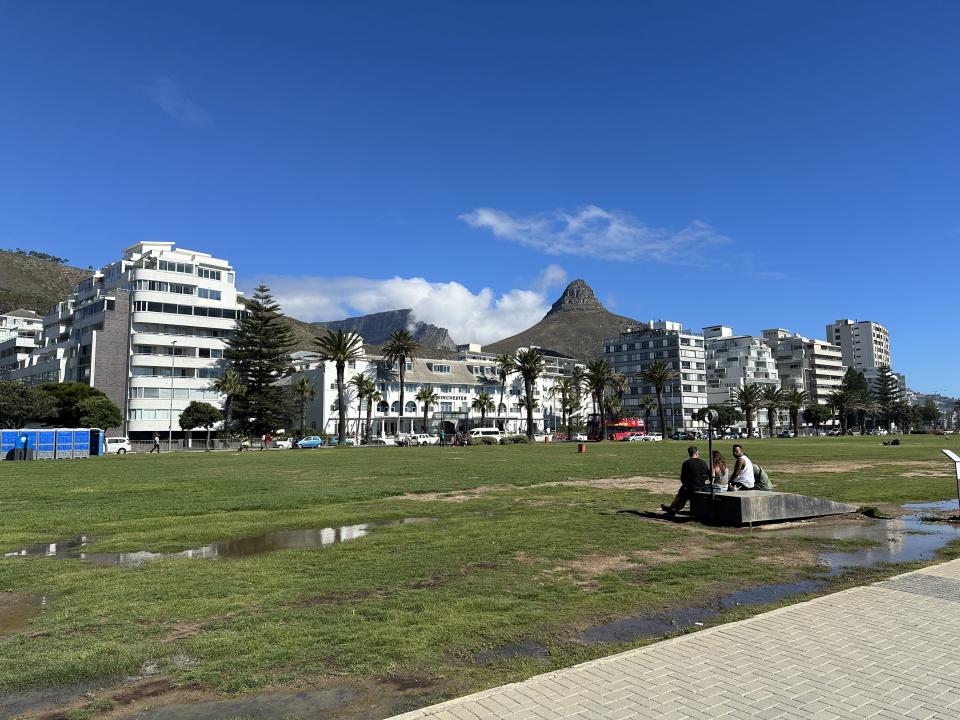 Lion's Head and Table Mountain seen from the Sea Point Promenade in Cape Town.