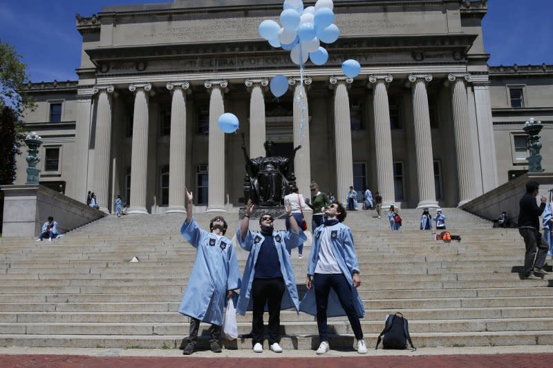 Columbia University graduates celebrate with balloons on the steps to the Library known as "Low Beach" after Columbia held its 266th academic year in New York City, May 2020. Due to the pandemic, Columbia's graduation ceremony was held as a virtual event broadcast. File photo by John Angelillo/UPI