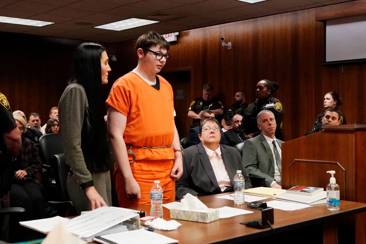 Ethan Crumbly stands and addresses the court before being sentenced, Friday, Dec. 8, 2023, in Pontiac, Mich. Crumbly was sentenced to life in prison for killing four students, wounding more, and terrorizing Michigan's Oxford High School in 2021. A judge Friday rejected pleas for a shorter sentence and ensured that Crumbley, 17, will not get an opportunity for parole.