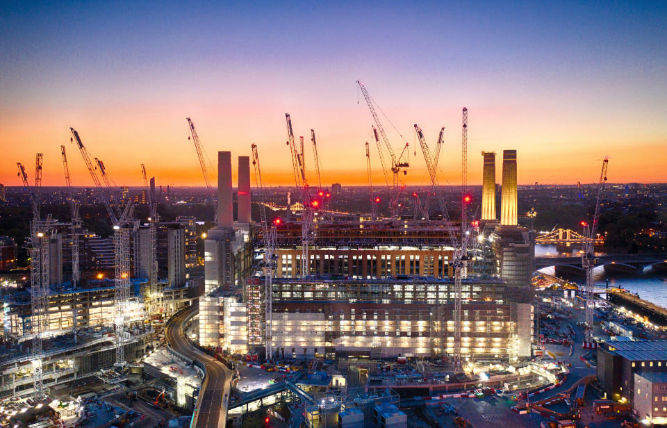 The Battersea Power Station development lights up the banks of the River Thames in London.