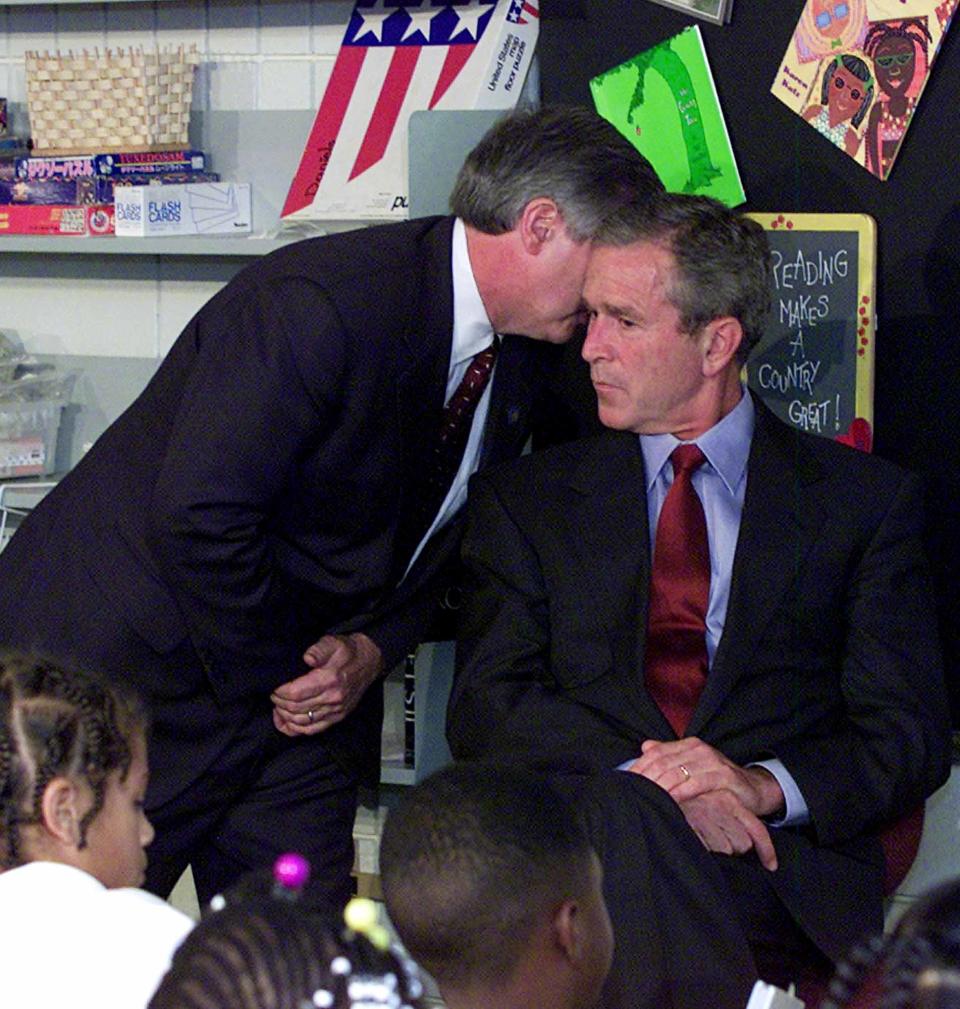 In this Sept. 11, 2001 file photo, President Bush's Chief of Staff Andy Card whispers into the ear of the President to give him word of the plane crashes into the World Trade Center, during a visit to the Emma E. Booker Elementary School in Sarasota, Fla.