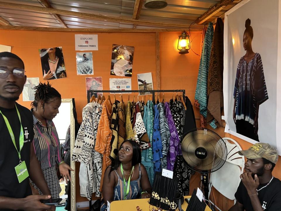 Awurama Mankatah, the founder of fashion brand Threaded Tribes, sits in her booth at the 2022 Afrochella Festival at El Wak Stadium in the greater Accra region of Ghana on Dec. 28, 2022. (theGrio Photo/Chinekwu Osakwe)