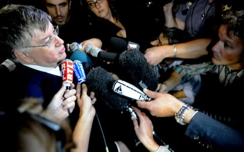 Mr Lombard at a 2009 press conference after an employee committed suicide by jumping from a highway overpass - Credit: AFP