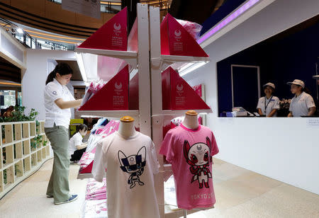 A staff member arranges products at the Tokyo 2020 Olympic Games mascot house in Tokyo, Japan, July 22, 2018. REUTERS/Kim Kyung-Hoon