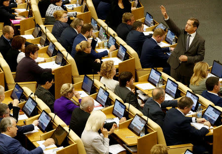 Deputies vote during a session to consider a law that will suspend Russian implementation of a treaty with Washington on cleaning up weapons-grade plutonium, at the State Duma, the lower house of parliament, in Moscow, Russia October 19, 2016. REUTERS/Sergei Karpukhin