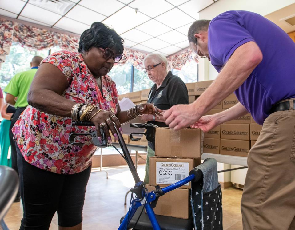Volunteers distribute hurricane meal kits to senior citizens in Pensacola on June 29. Seeking out service projects is not only a good way to contribute to a cause you care about, but also helps you meet people who share your values and sense of community.