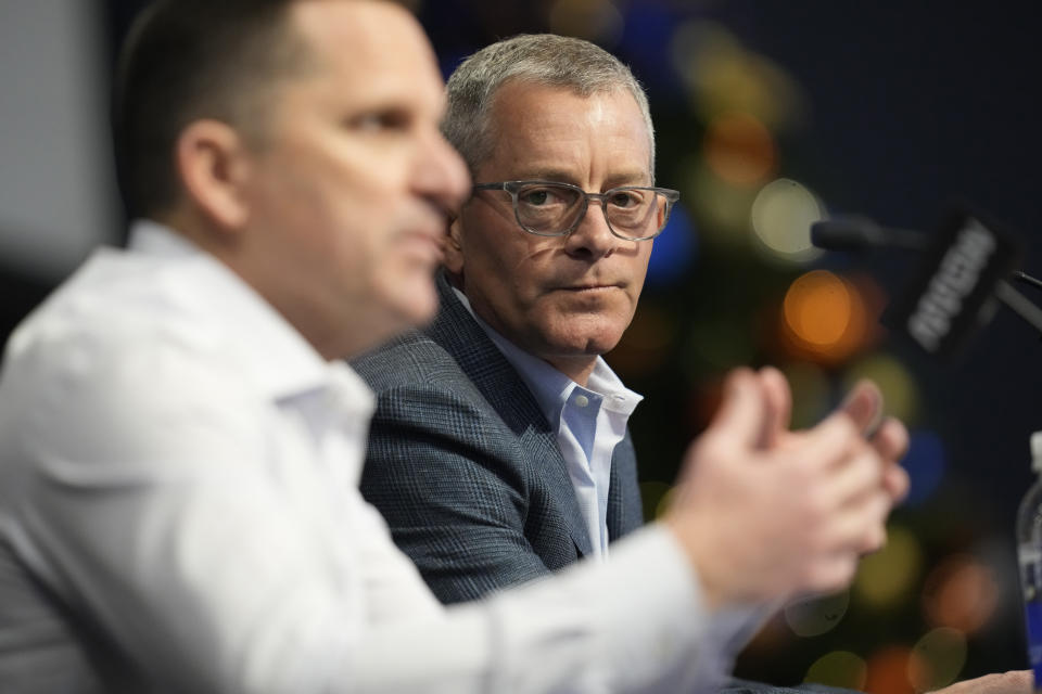 Denver Broncos chief executive officer Greg Penner, back, listens as general manager George Paton responds to a question during a news conference about the firing of head coach Nathaniel Hackett Tuesday, Dec. 27, 2022, in Englewood, Colo. (AP Photo/David Zalubowski)