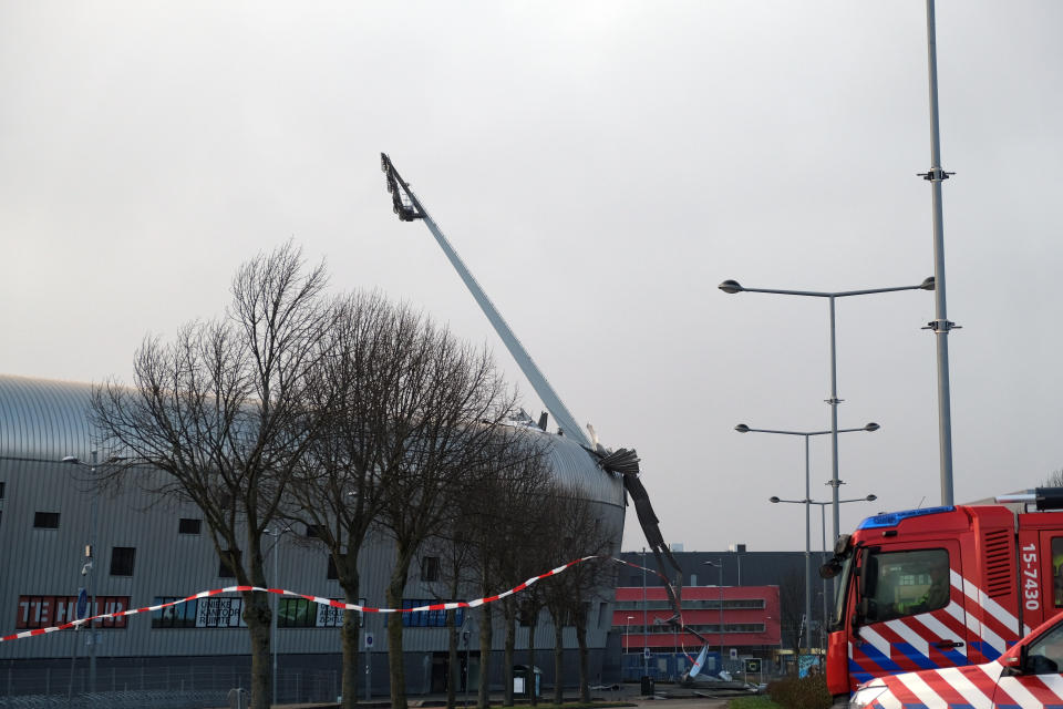 Part of the roof of soccer club ADO The Hague’s stadium blows off as storm Eunice batters the Netherlands on Friday, Feb. 18, 2022. The Dutch weather institute issued its highest warning, code red, for coastal regions of the Netherlands and code orange for much of the rest of the country as the storm bore down on the low-lying nation. (AP Photo/Michael Corder)